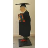 A modern novelty waiter, fashioned as a headmaster, wearing a gown and mortarboard  32"h