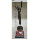 An Art Deco style patinated bronze figure, a female dancer, on a marble and slate effect plinth