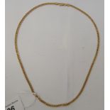 An 18ct gold curb link necklace, on a dog clip clasp