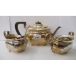A three piece George V silver tea set  comprising a teapot, a cream jug and sugar basin