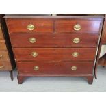 An Edwardian string inlaid mahogany dressing chest, comprising two short/three long drawers,