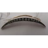 An 18ct gold and platinum, diamond set crescent brooch