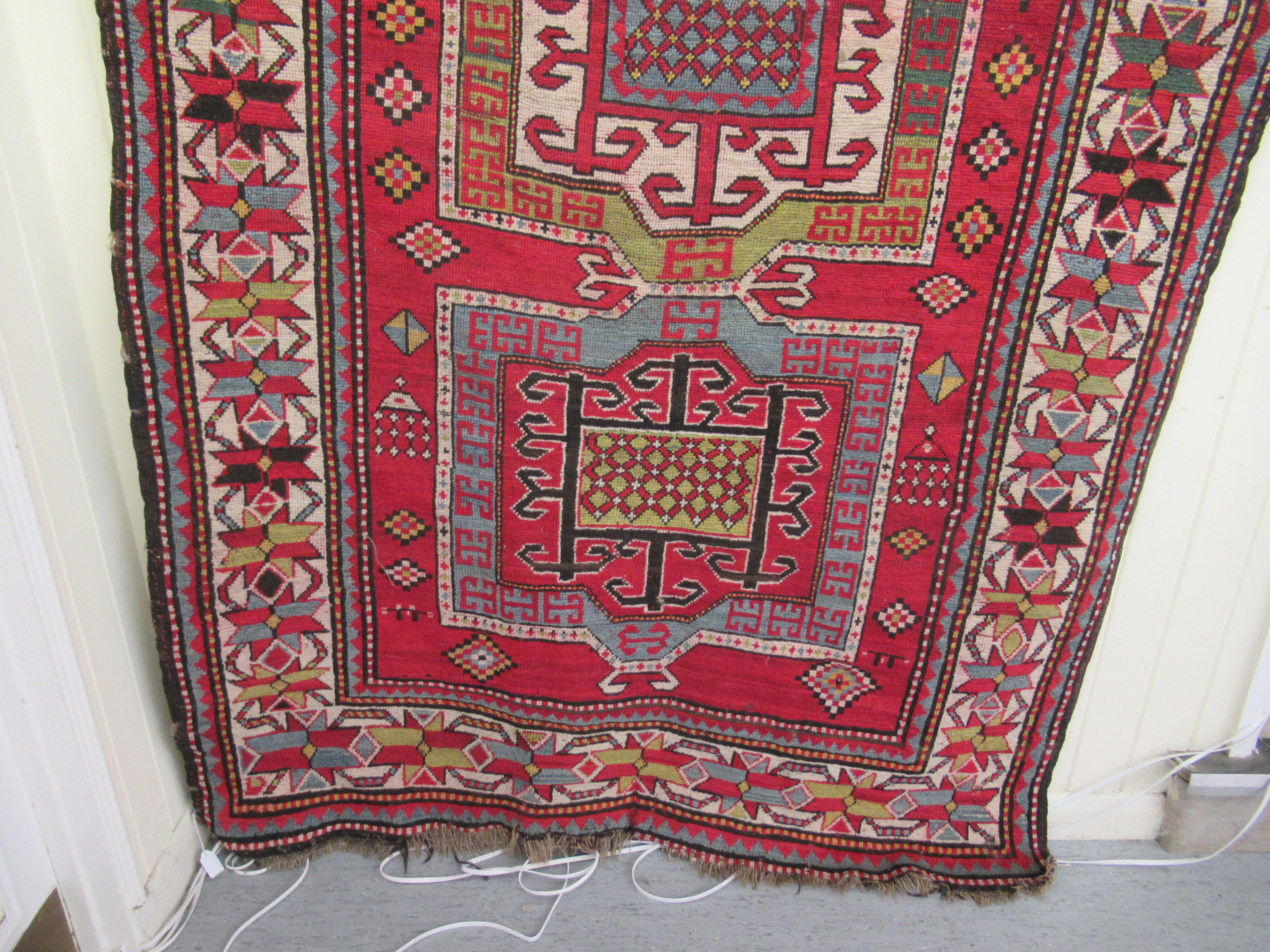 An Afghan Kazak rug, decorated with repeating geometric designs, on a cream ground  52" x 94" - Image 2 of 4