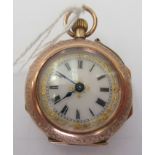 A 9ct gold cased fob watch with engraved and enamelled green ornament, the keyless movement faced by