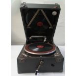 A 1930s Columbia portable gramophone with a folding handle, in a black fabric covered case