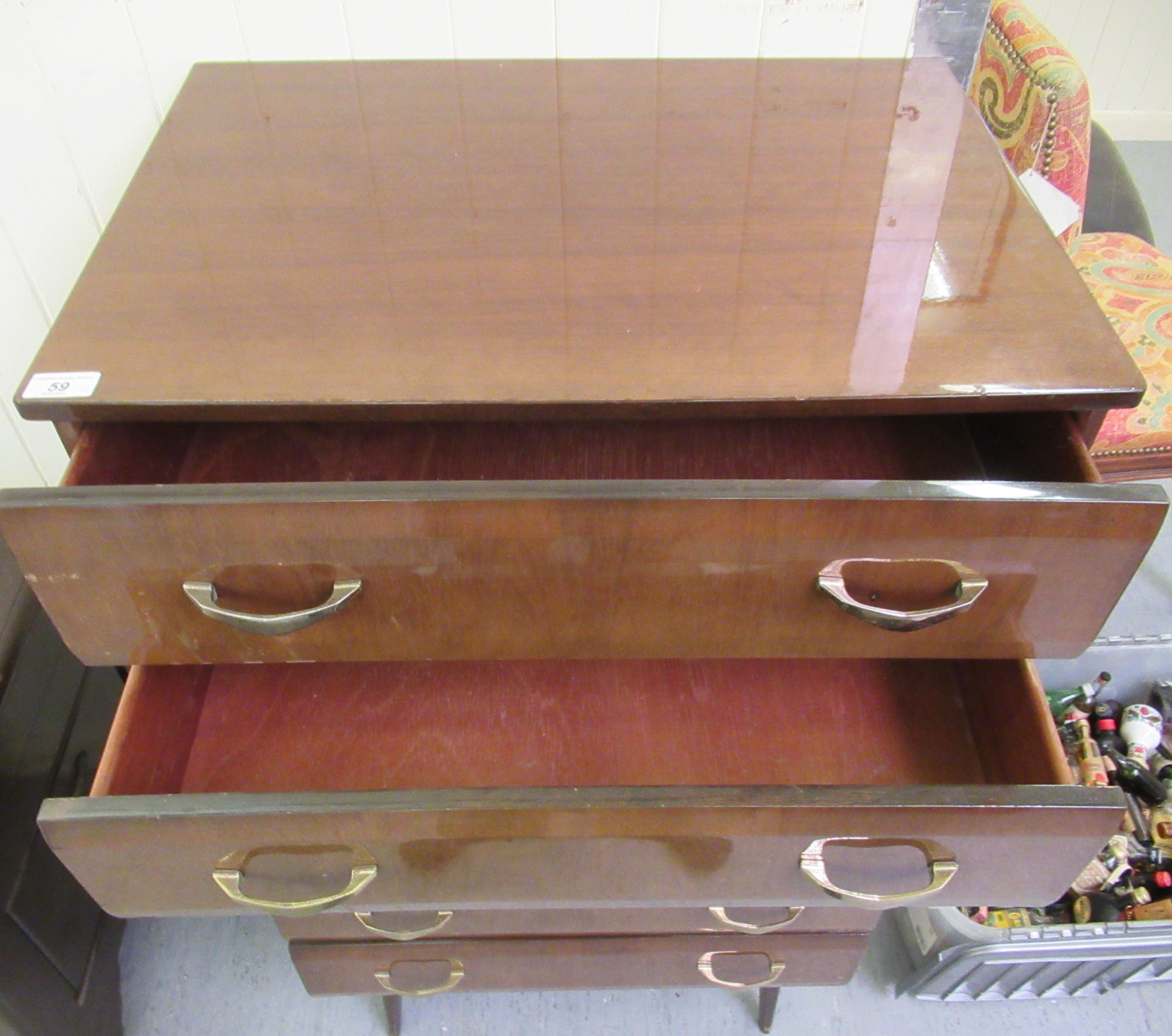 A mid 20thC mahogany finished six drawer dressing chest, raised on tapered legs  45"h  26"w - Image 2 of 4