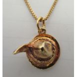 A 14ct gold fine box link neckchain with a 14ct gold, Tyrolean hat pendant, on a ring bolt clasp