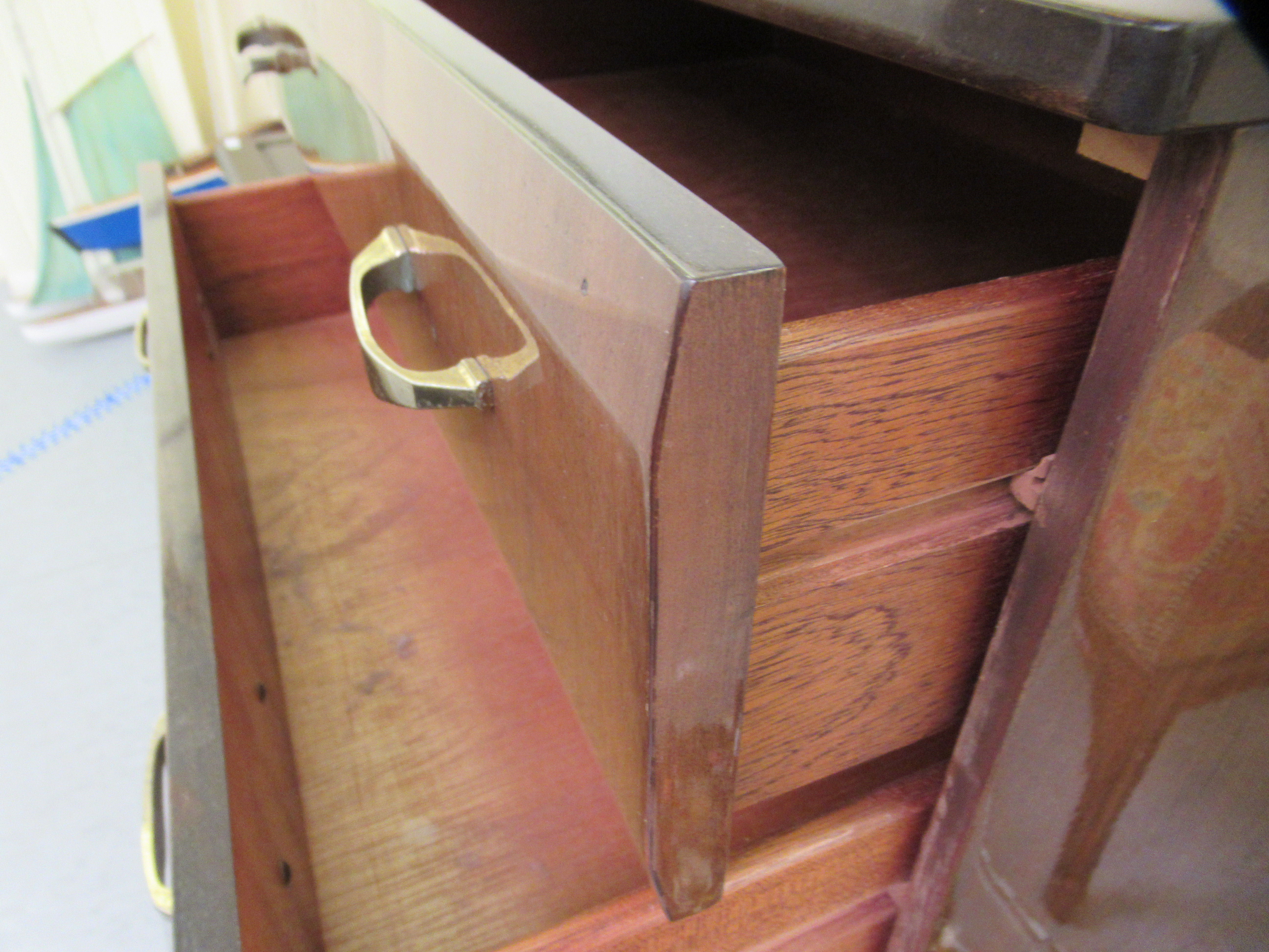 A mid 20thC mahogany finished six drawer dressing chest, raised on tapered legs  45"h  26"w - Image 3 of 4