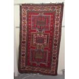 An Afghan Kazak rug, decorated with repeating geometric designs, on a cream ground  52" x 94"