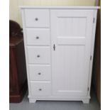 A Laura Ashley white painted bedroom cabinet, comprising an arrangement of drawers and doors, on a