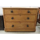 A late Victorian pine dressing chest, comprising two short/two long drawers, on a plinth  30"h  42"w