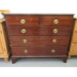 An Edwardian string inlaid mahogany dressing chest, comprising two short/three long drawers,