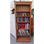 A modern stained pine open front bookcase, on a plinth  79"h  32"w