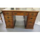 An early 20thC oak nine drawer, twin pedestal desk, on a plinth  30"h  48"w