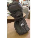 A carved African hardwood bust, a man smoking a pipe  14"h