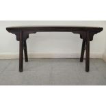 An early 20thC Chinese rustic elm bench, raised on turned, outset legs  21"h  44"w