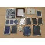 A small collection of variously framed photograph frames  mixed sizes