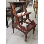 A reproduction of William IV mahogany finished, three tread library steps  31"h