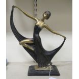 A cast and part painted bronze figure, a 1920s dancer, on a plinth  15"h