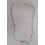 A graduated pearl necklace, on a white metal clasp