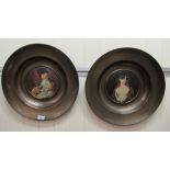 A pair of modern copper chargers, each set with a print, one a portrait of Mrs Siddons by Thomas