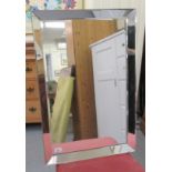A modern mirror, the five section bevelled plates set on board  20" x 30"