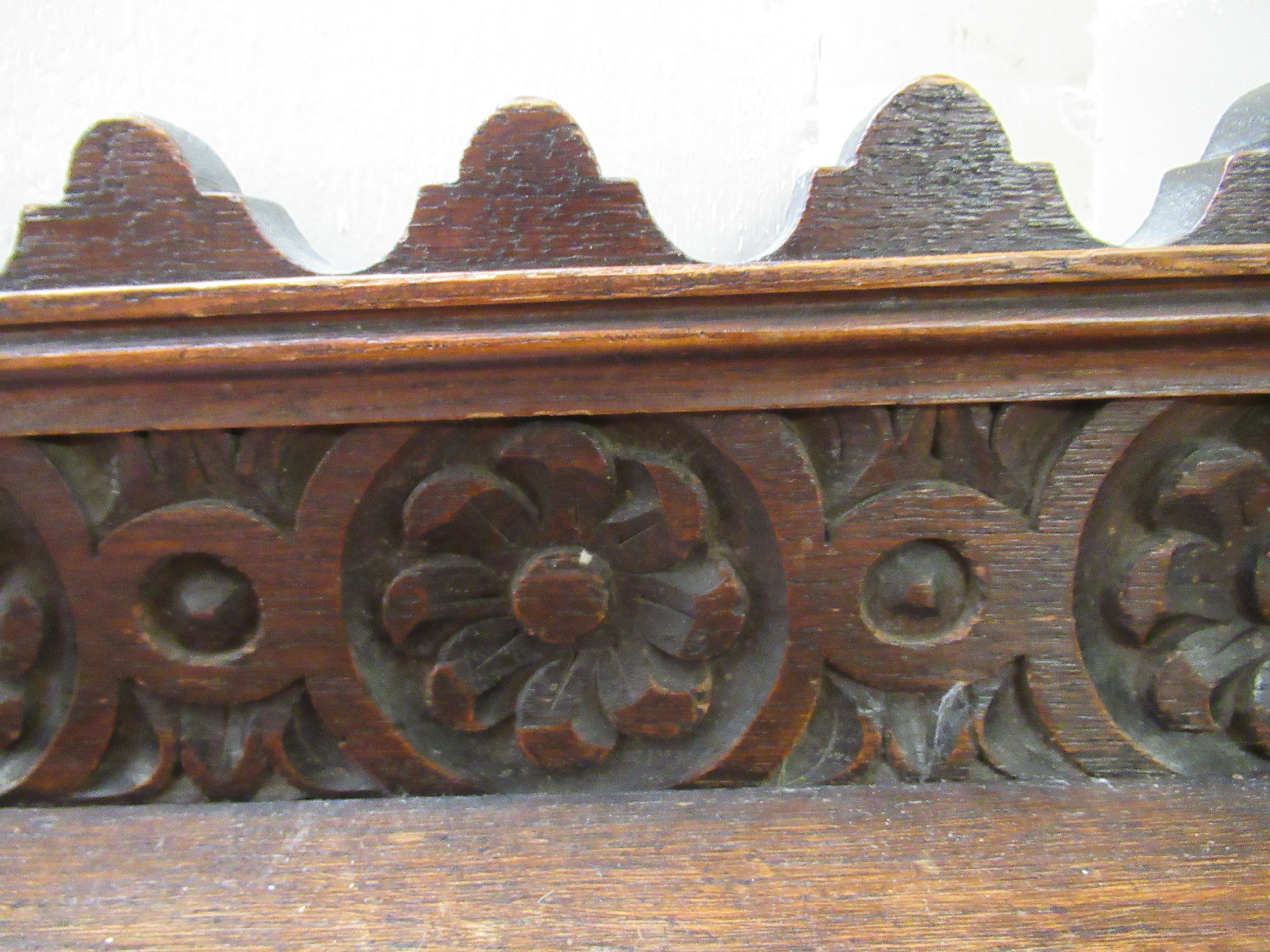 A late Victorian oak window seat with a carved gallery back and turned arms, raised on ring turned - Image 4 of 5