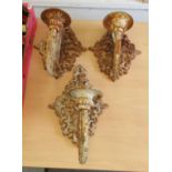 A set of three early 20thC painted cast iron terrace wall lights, each comprising a scrolled