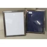 A pair of glazed plain silver photograph frames, on fabric backs and easel stands  indistinct London