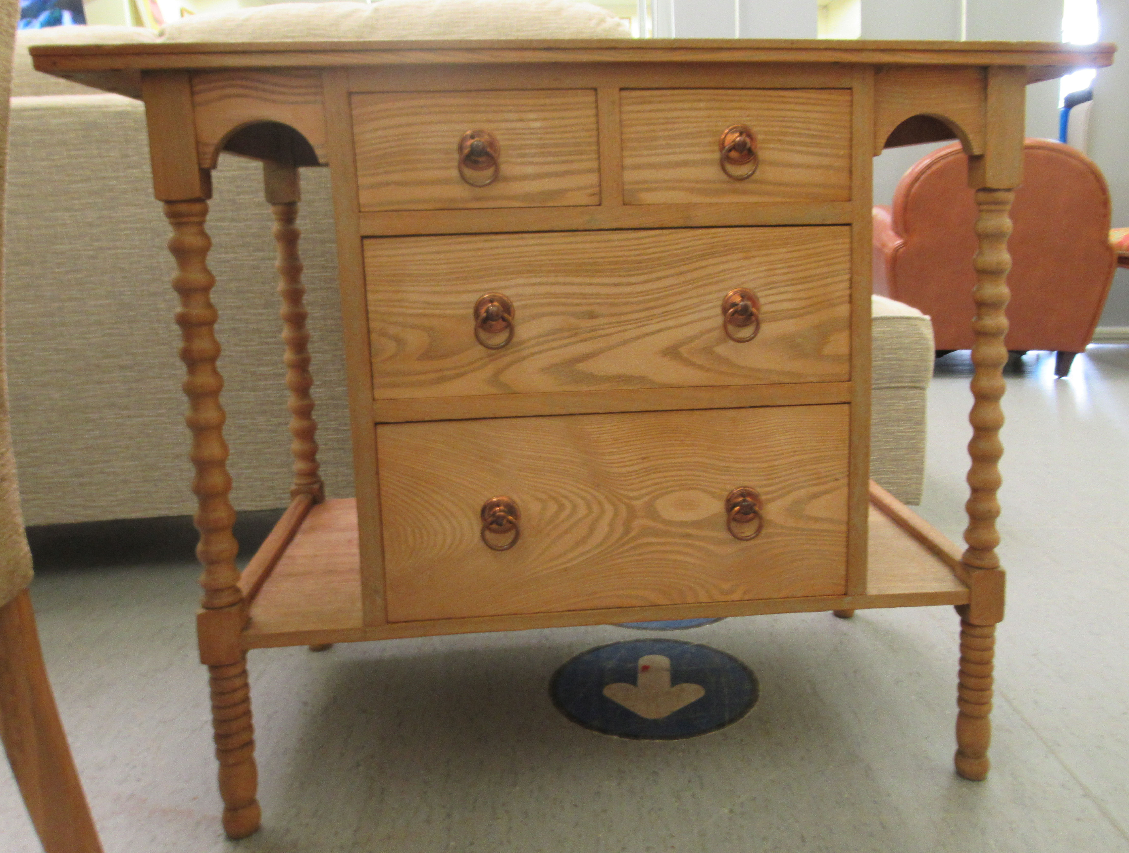 An Edwardian style light oak washstand with two short/two long central drawers, flanked by