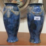 A pair of Art Nouveau period Royal Doulton streaky glazed stoneware vases of tapered form, decorated