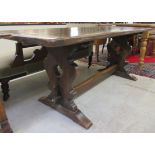 A late 19thC Jacobean design oak refectory table, raised on opposing vase shaped ends and platform