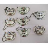 A set of three painted steel enamel wine labels, on chains; and a set of four similar Crown