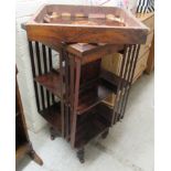 An Edwardian satinwood inlaid walnut revolving bookcase, the top with a marquetry panel, over