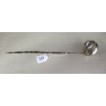 A late 18th/early 19thC silver coloured metal toddy ladle, on a whalebone twist handle