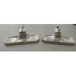 A pair of Art Deco pewter desk stands, each comprising an inkwell and shallow pen tray  10"w