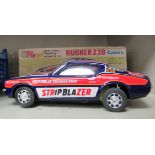A 1969 Rusher Z28 Camaro Bump-n-Go tinplate, battery powered toy car  boxed