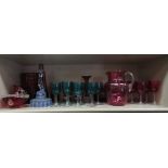 Decorative coloured glassware: to include a cranberry coloured water jug with a drawn loop handle;