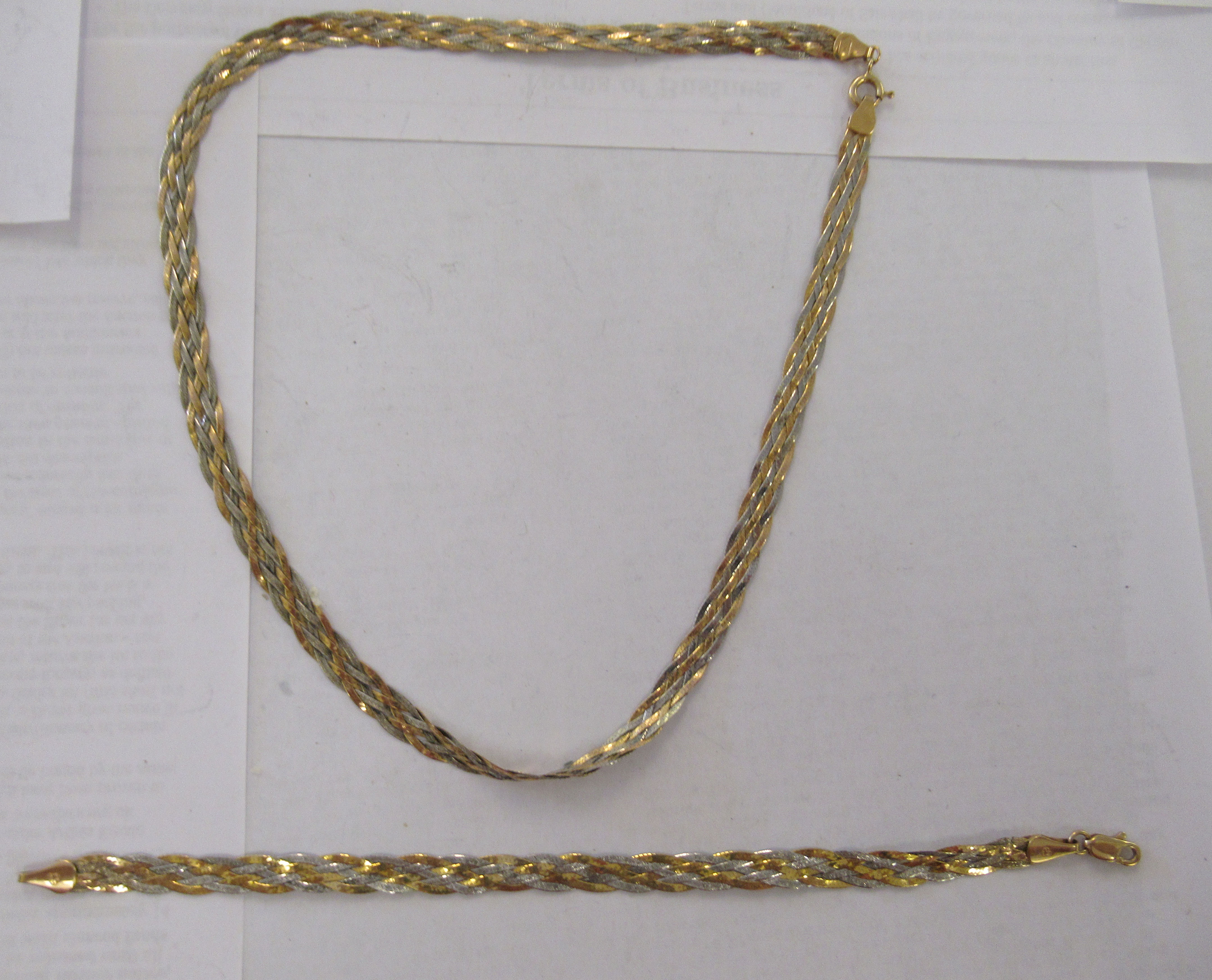 An Italian 9ct bi-coloured gold, crossover design bracelet; and matching necklace