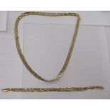 An Italian 9ct bi-coloured gold, crossover design bracelet; and matching necklace