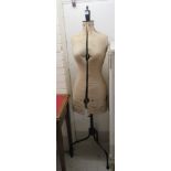 A modern mid 20thC dressmaker/tailor's fabric covered mannequin, on a black painted metal tripod