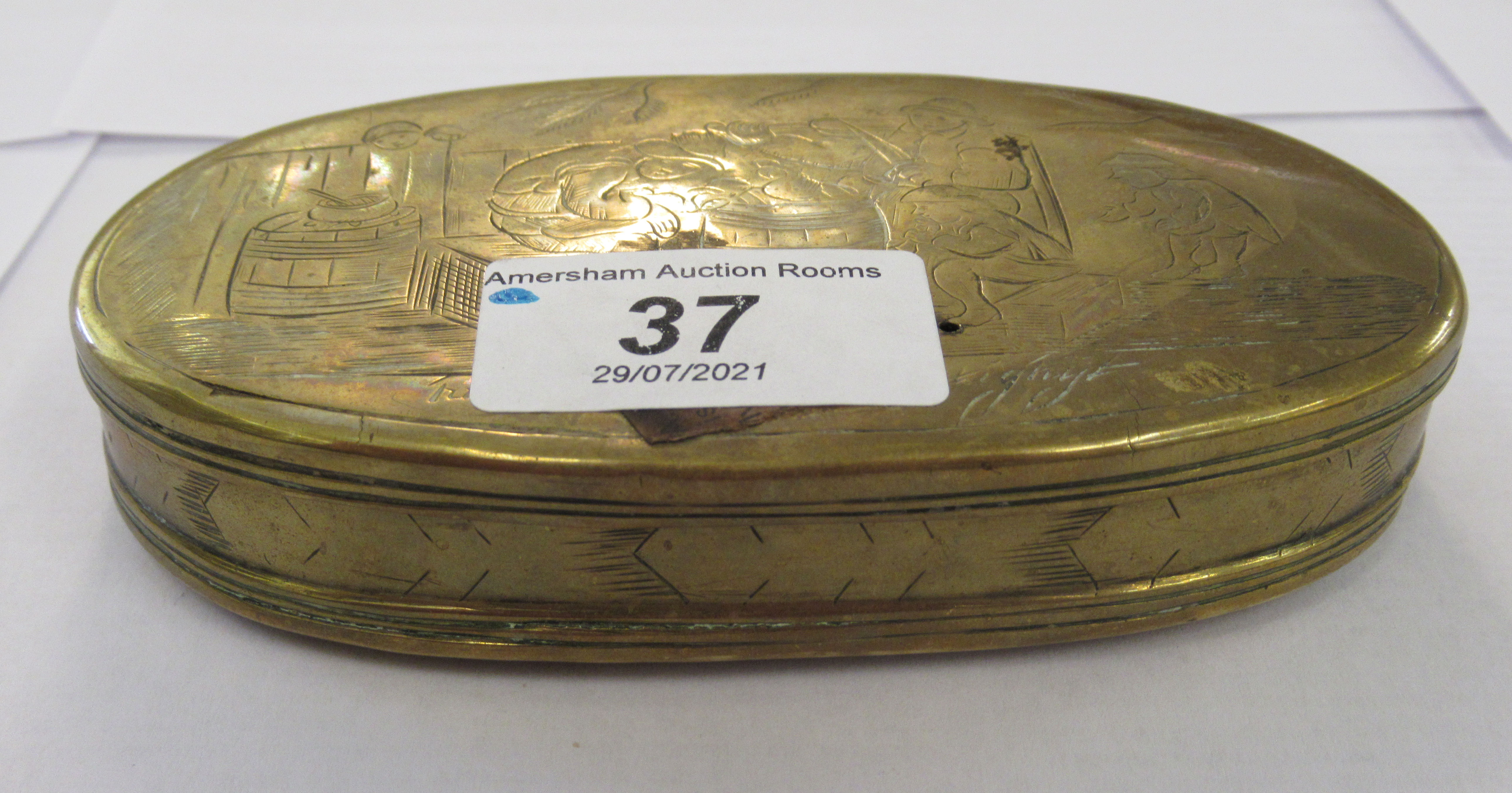 An early 19thC (possibly Dutch) brass oval snuff box, decorated with a fishing village  5"dia