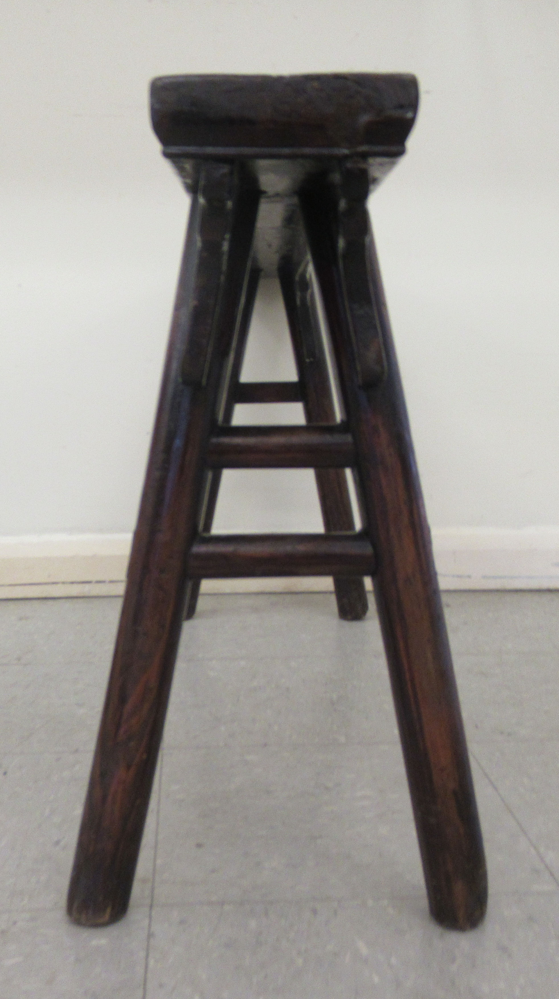 An early 20thC Chinese rustic elm bench, raised on turned, outset legs  21"h  44"w - Image 4 of 5