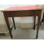 An Edwardian oak side table, the top set with a red hide scriber, over a frieze drawer, raised on