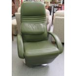 A modern green hide upholstered chair, raised and rotating on a