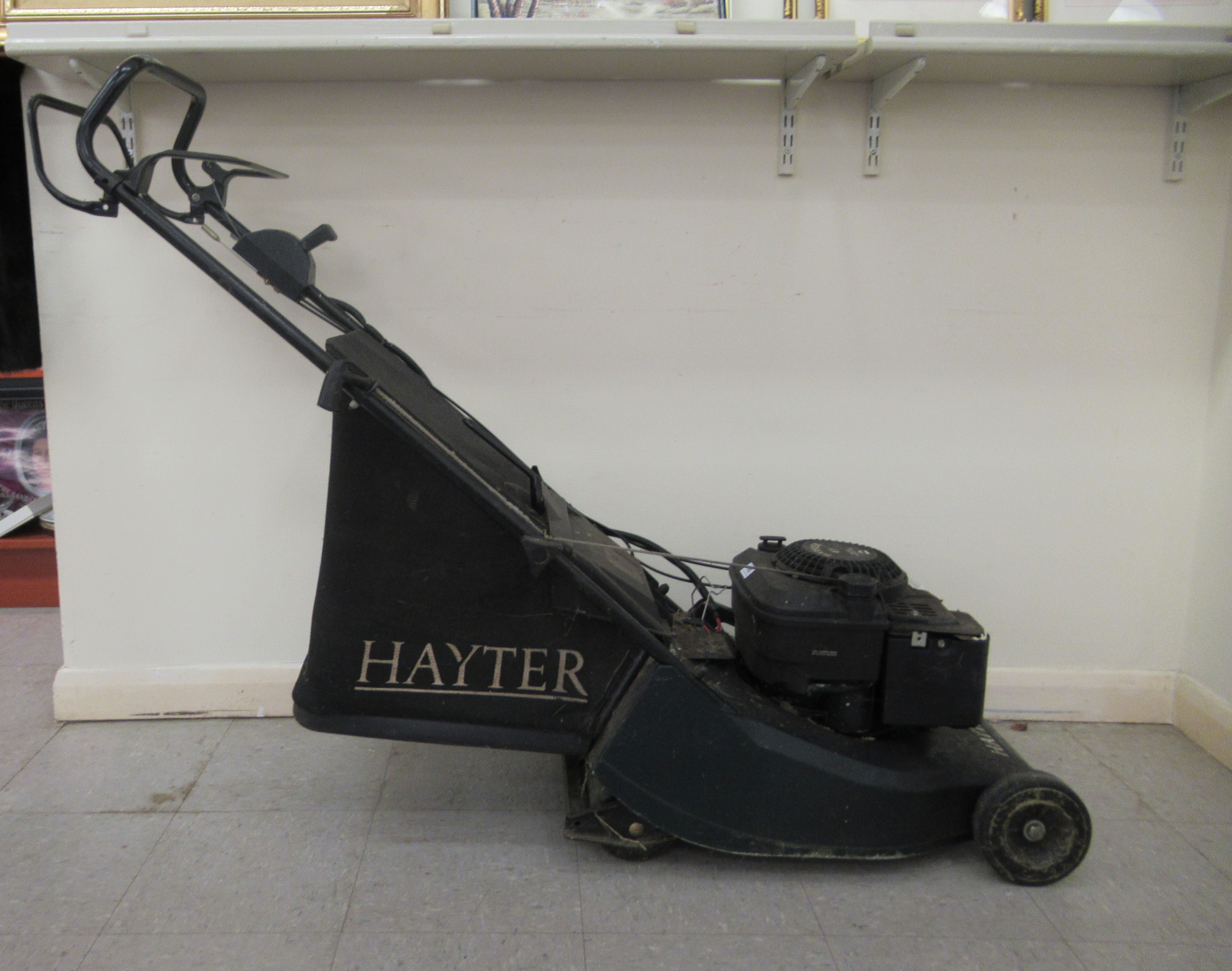 A Hayter Harrier 41 petrol driven lawn mower with a 15"dia rotary cut and grassbox