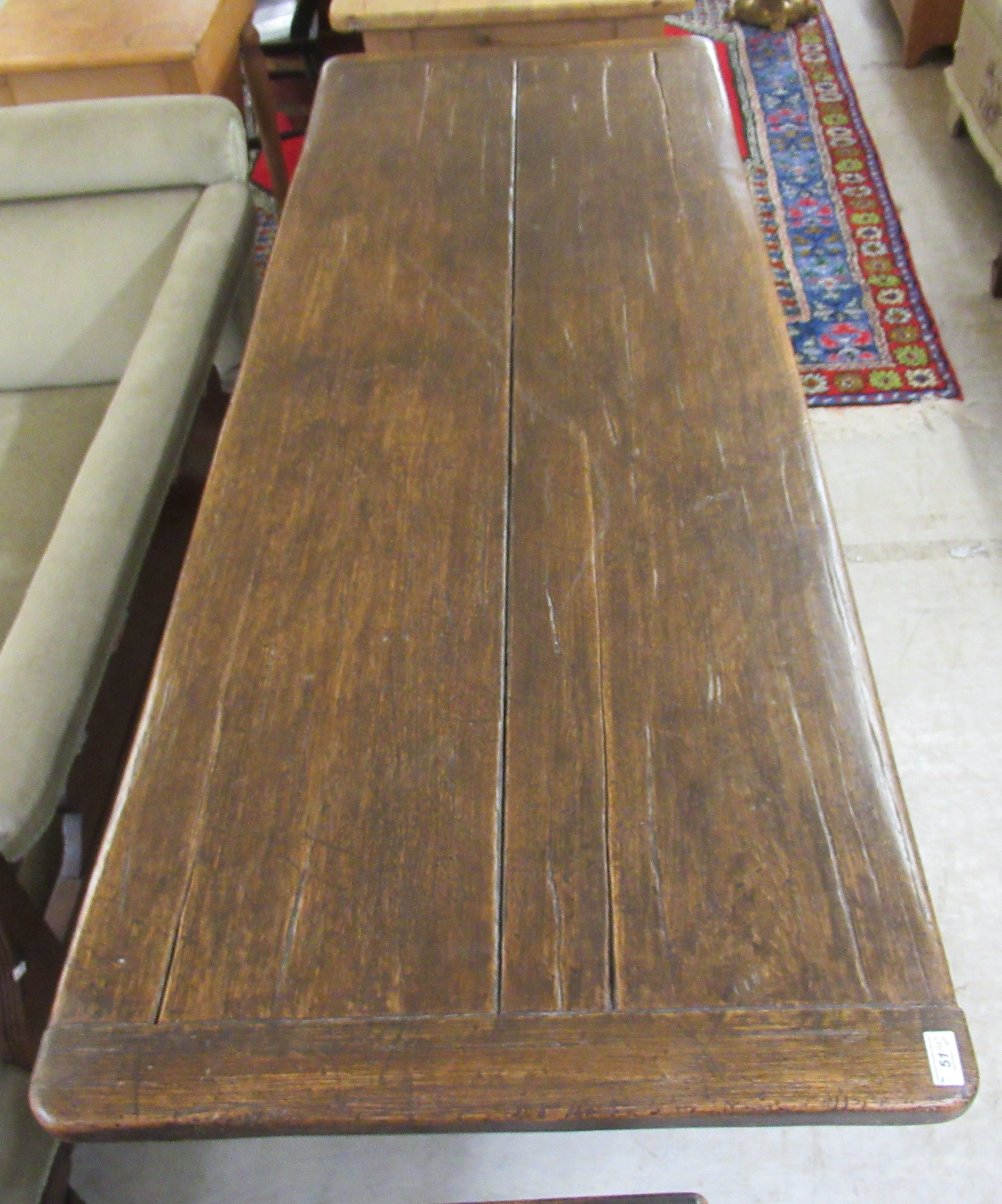 A late 19thC Jacobean design oak refectory table, raised on opposing vase shaped ends and platform - Image 2 of 3