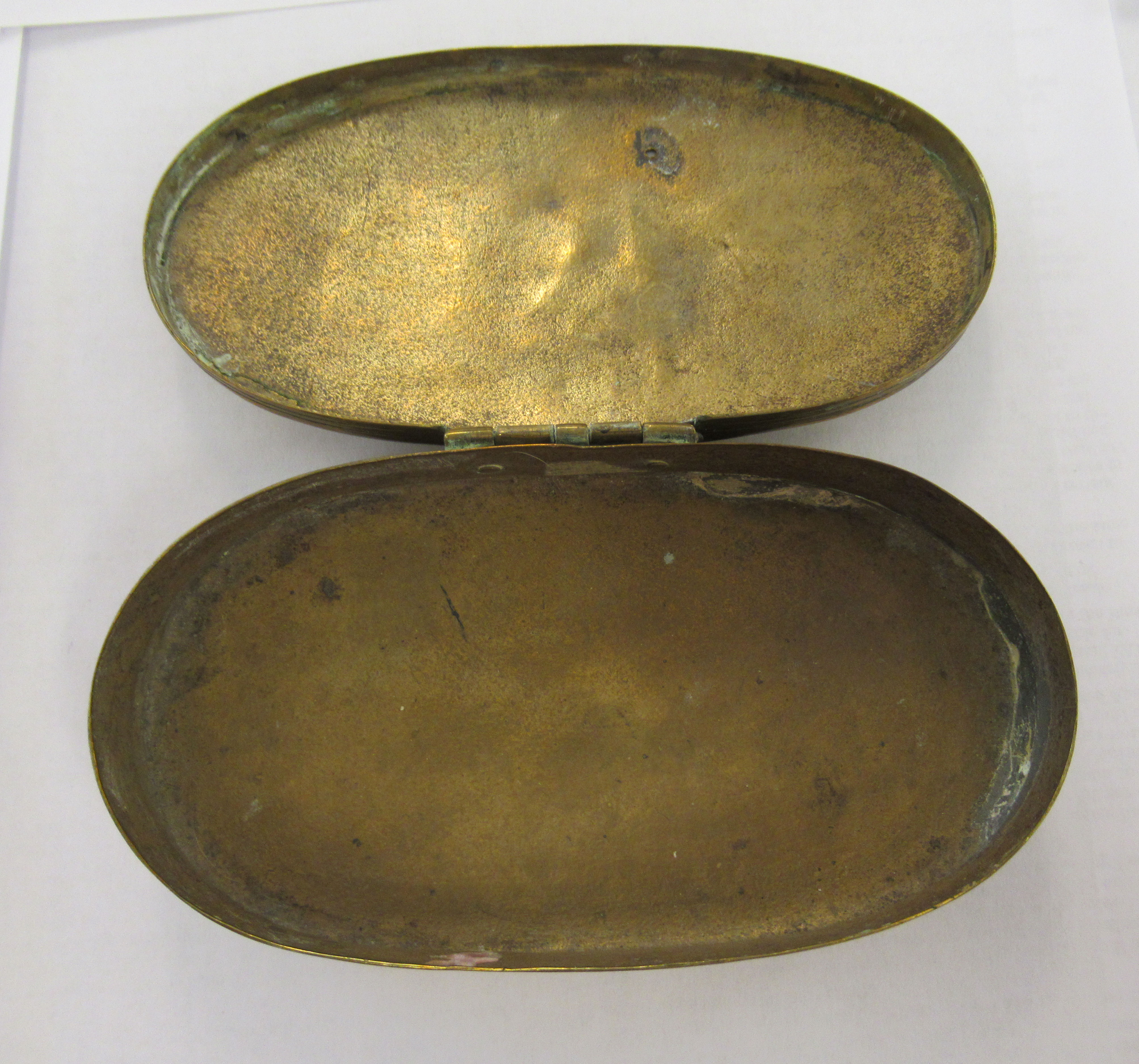 An early 19thC (possibly Dutch) brass oval snuff box, decorated with a fishing village  5"dia - Image 3 of 3