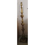A mid 20thC gilded cast metal standard lamp, decorated with free-flowing designs and foliage  64"h
