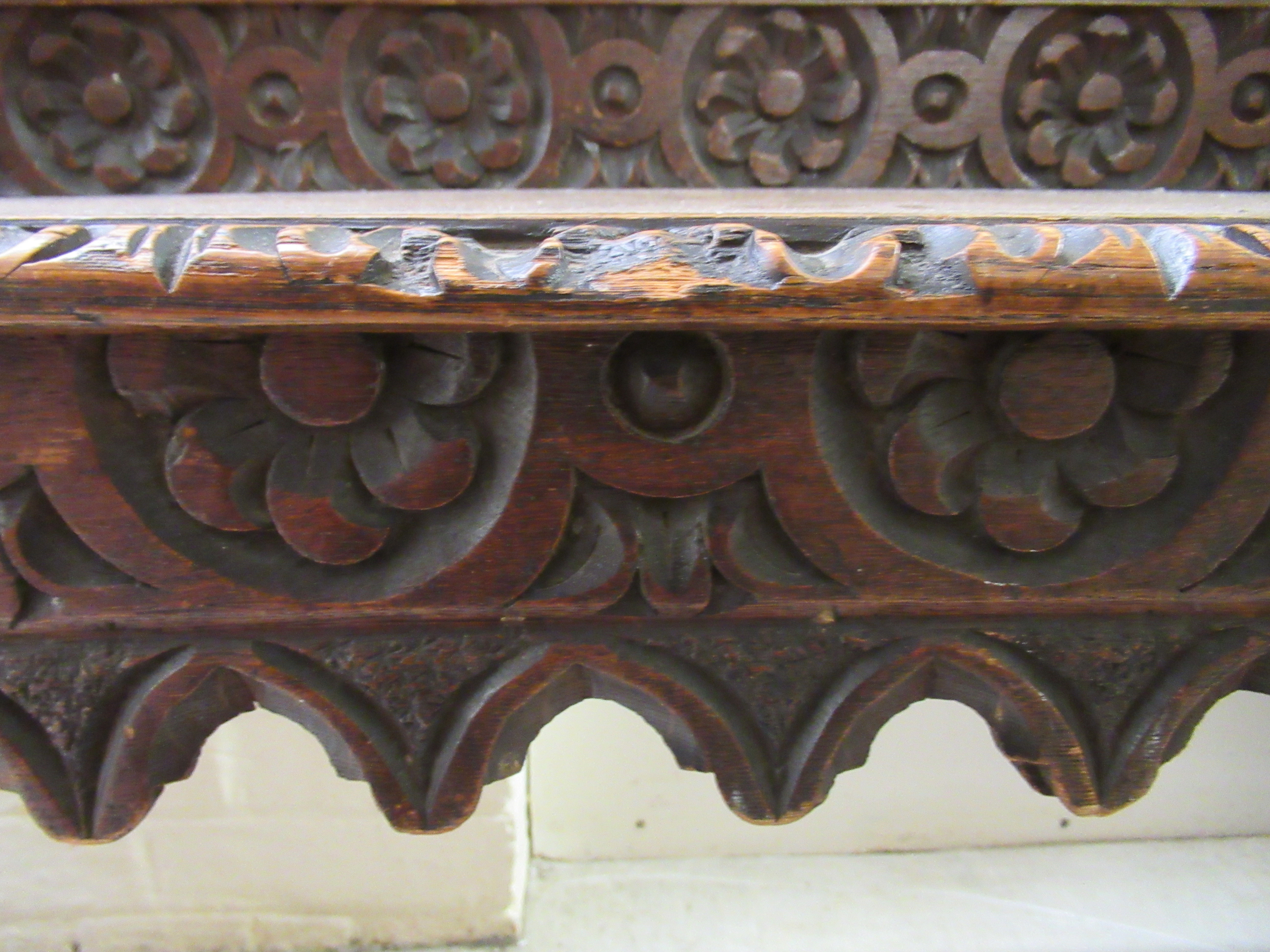 A late Victorian oak window seat with a carved gallery back and turned arms, raised on ring turned - Image 5 of 5